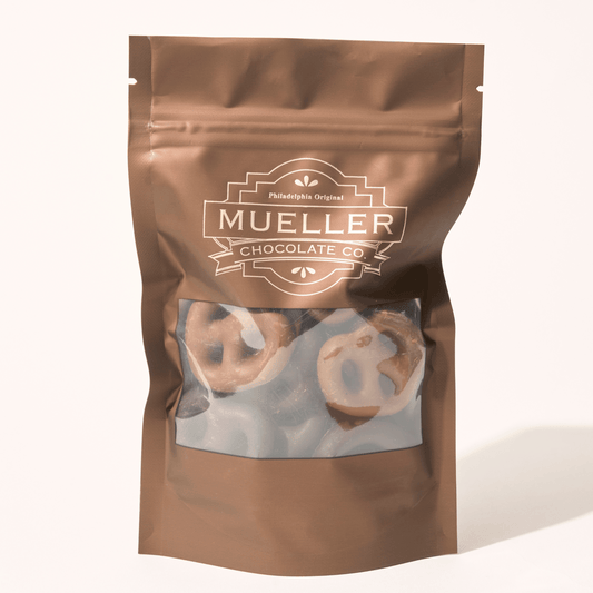 1/4 lb Milk Chocolate Mini Pretzel Gift Bags filled with crunchy mini pretzels coated in creamy milk chocolate, perfect for gifting or snacking.