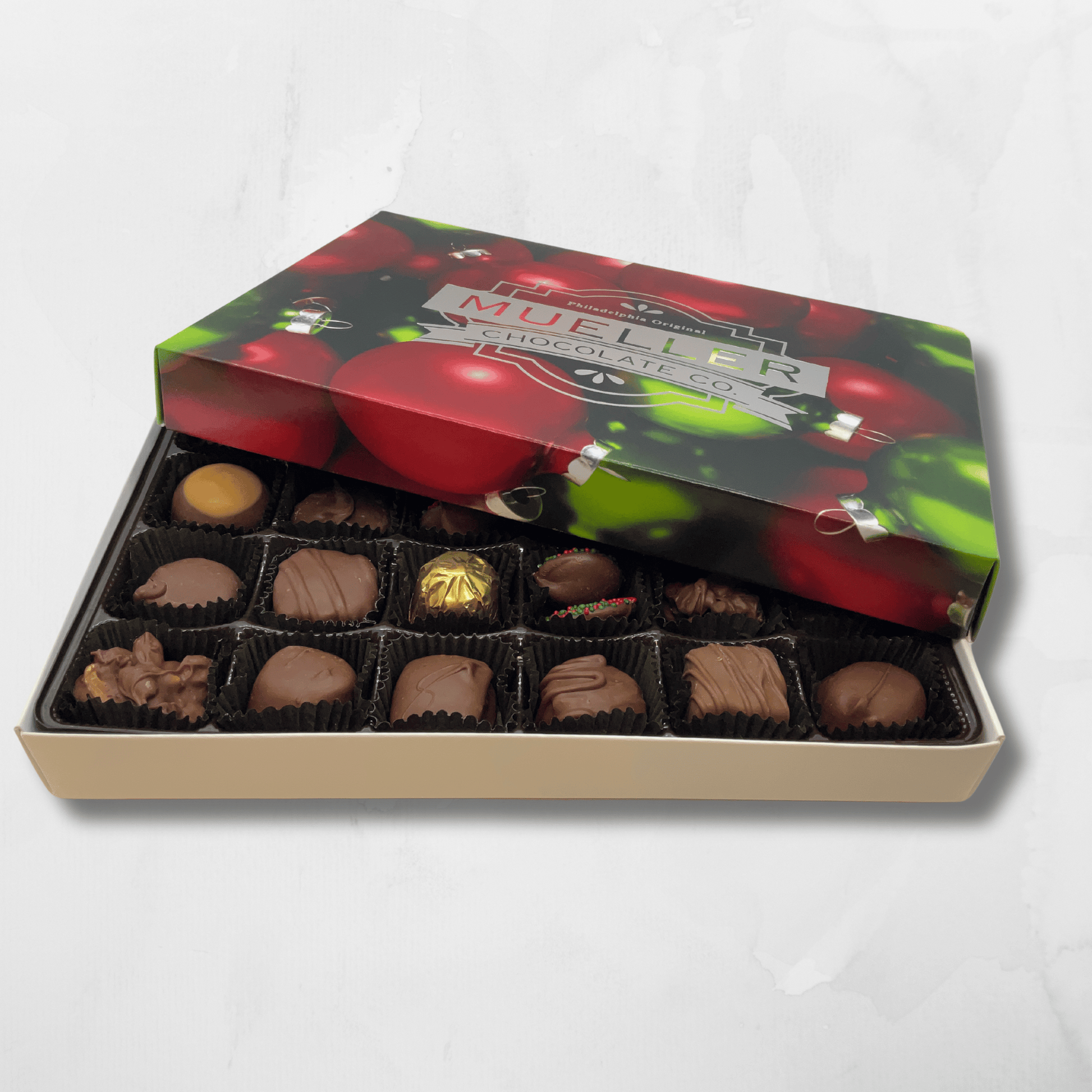 Holiday 1 lb milk chocolate assortment gift box with festive packaging.