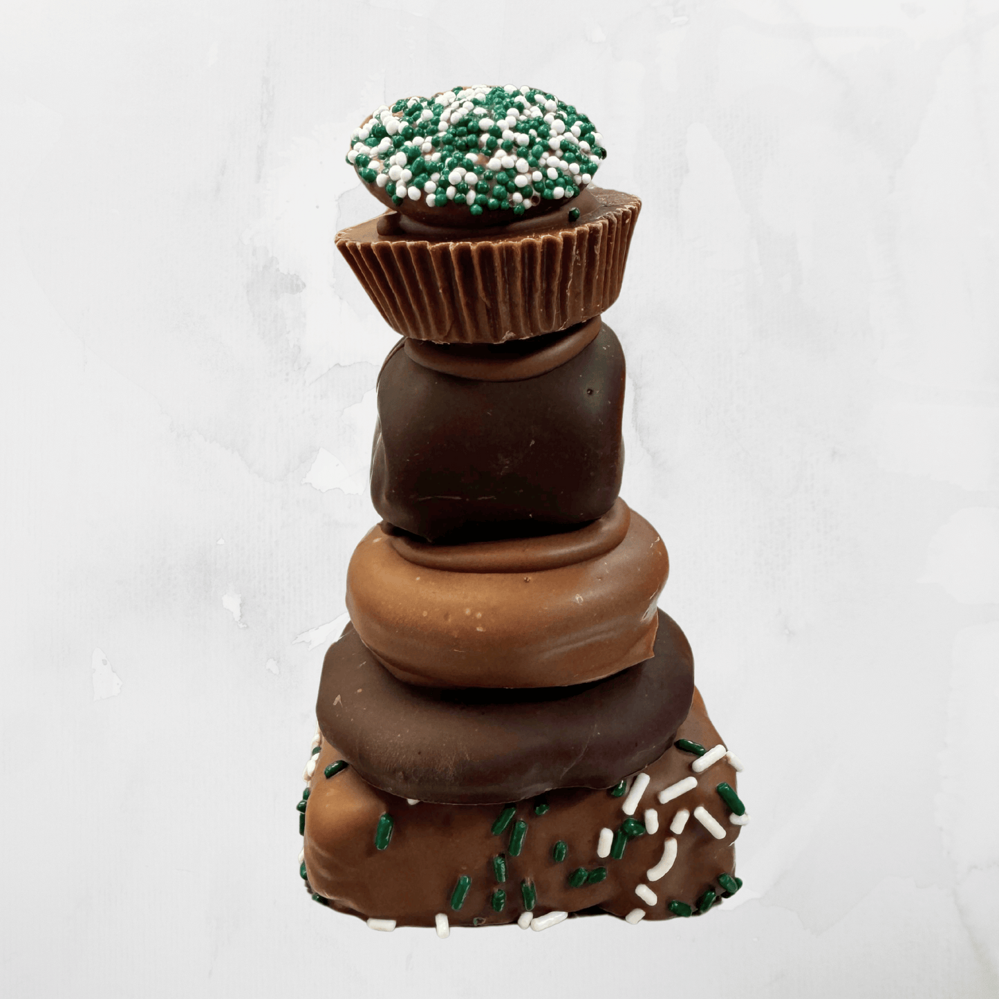 Mueller’s Eagles-Themed Chocolate Tower, a gourmet stack of chocolate-covered treats decorated in Philadelphia Eagles colors, featured on the Food Network. A perfect game-day or gift choice for Eagles fans.