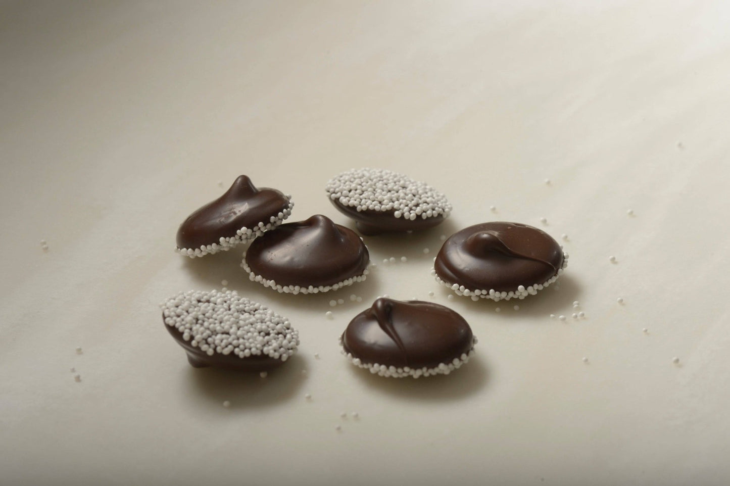 Dark Chocolate Nonpareils with White Seeds - Handmade Chocolate | Mueller Chocolate Co.