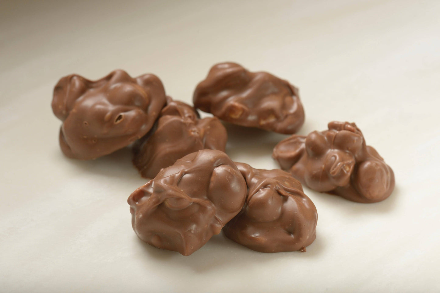 Gourmet Milk Chocolate Macadamia Clusters - Mueller Chocolate Co