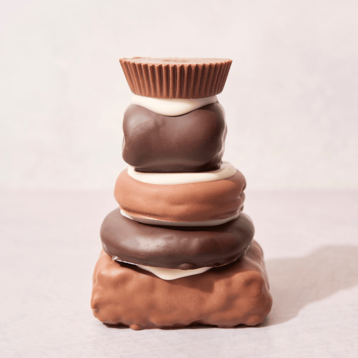 Mueller’s Chocolate Tower, a gourmet stack of chocolate-covered treats, featured on the Food Network. A must-try for chocolate lovers.